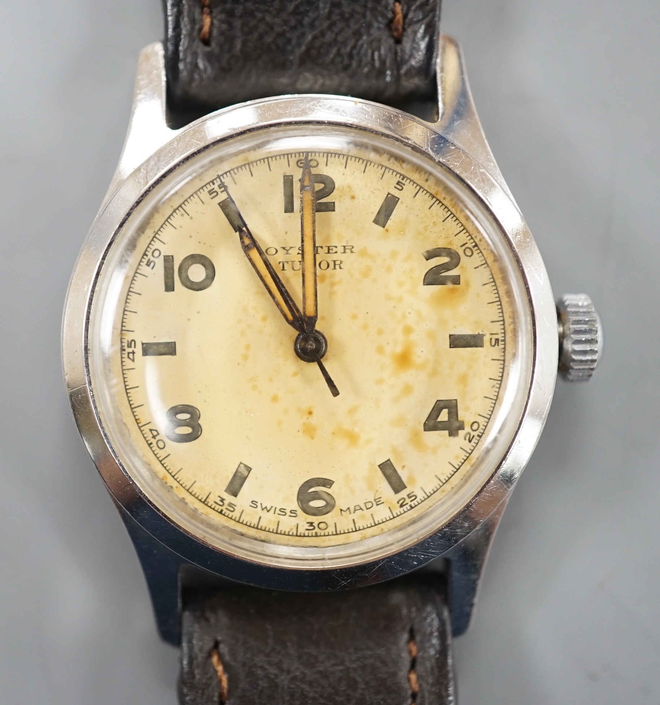 A gentleman's mid 20th century stainless steel Tudor Oyster manual wind wrist watch, with baton and Arabic dial, on later associated leather strap.